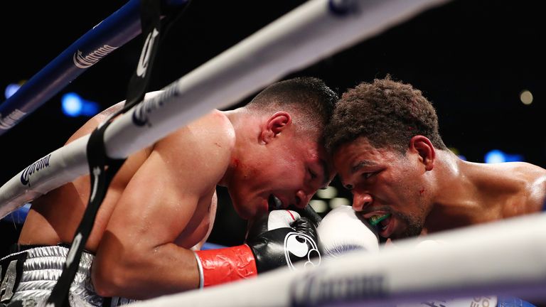 NEW YORK, NY - NOVEMBER 04:  Shawn Porter and Adrian Granados exchange punches during their WBC welterweight title eliminator at the Barclays Center on Nov