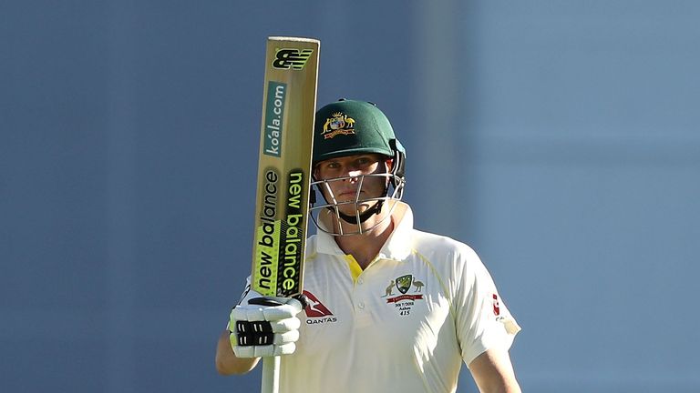 Steve Smith of Australia celebrates after reaching his half century  during day two of the First Ashes Test