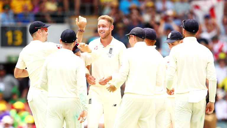 Stuart Broad of England celebrates with his team after taking the wicket of Mitchell Starc of Australia