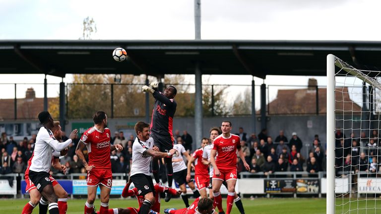Swindon goalkeeper Reice Charles-Cook makes a save during FA Cup first round match against Dartford