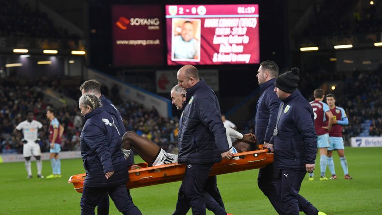 Swansea City's Tammy Abraham is stretchered off following a challenge by Burnley's Charlie Taylor 