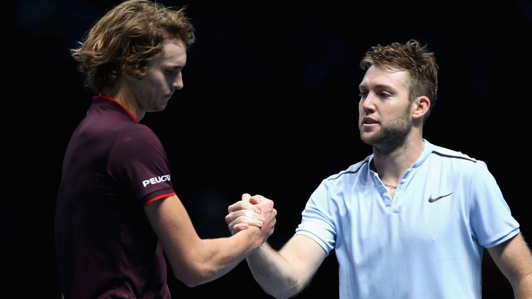 Jack Sock of The United States is congratulated on victory from opponent Alexander Zverev of Germany