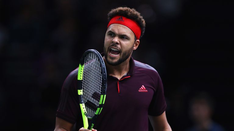 Jo-Wilfried Tsonga of France reacts to a missed shot as he plays his match against Julien Benneteau of France