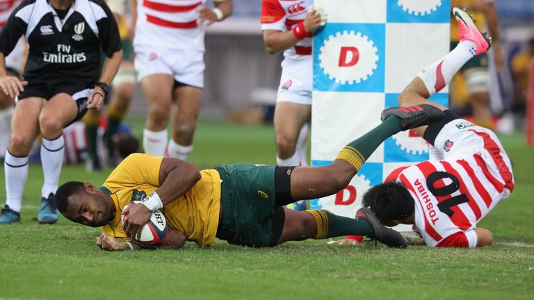 Tevita Kuridrani of Australia dives over for his third try against Japan