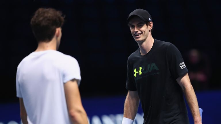 LONDON, ENGLAND - NOVEMBER 11:  Andy Murray of Great Britain shares a joke with hitting partner Dominic Thiem of Austria during a training session prior to