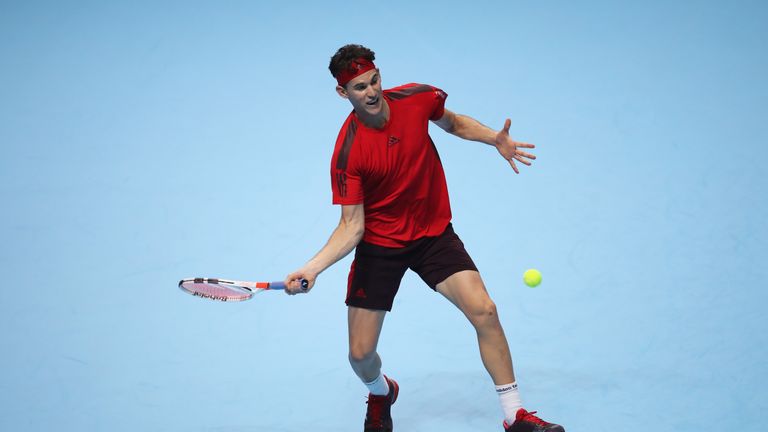 LONDON, ENGLAND - NOVEMBER 13:  Dominic Thiem of Austria plays a forehand in the Singles match against Grigor Dimitrov of Bulgaria during day two of the Ni