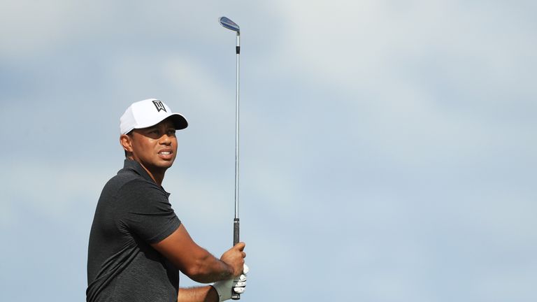 NASSAU, BAHAMAS - NOVEMBER 30:  Tiger Woods of the United States plays a shot on the fourth hole during the first round of the Hero World Challenge at Alba