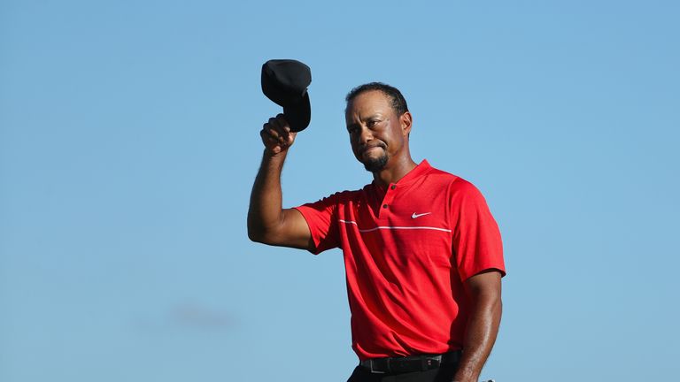 NASSAU, BAHAMAS - DECEMBER 04:  Tiger Woods of the United States tips his cap on the 18th hole during the final round of the Hero World Challenge at Albany