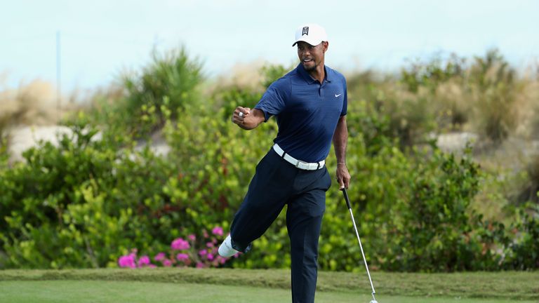 NASSAU, BAHAMAS - DECEMBER 02:  Tiger Woods of the United States celebrates a birdie putt on the 16th green during round two of the Hero World Challenge at