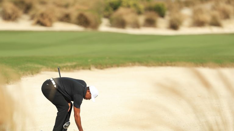 NASSAU, BAHAMAS - NOVEMBER 30:  Tiger Woods of the United States checks his lie on the sixth hole during the first round of the Hero World Challenge at Alb