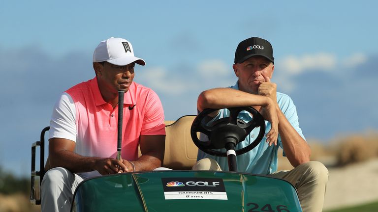 NASSAU, BAHAMAS - NOVEMBER 29:  Tiger Woods of the United States talks to Golf Channel reporter Jim "Bones" Mackay during the pro-am prior to the Hero Worl