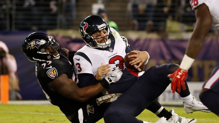 BALTIMORE, MD - NOVEMBER 27: Quarterback Tom Savage #3 of the Houston Texans is sacked by outside linebacker Terrell Suggs #55 of the Baltimore Ravens in t