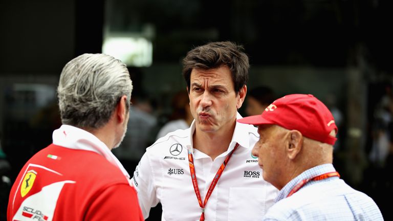 KUALA LUMPUR, MALAYSIA - SEPTEMBER 29: Ferrari Team Principal Maurizio Arrivabene talks with Mercedes GP Executive Director Toto Wolff and Mercedes GP non-