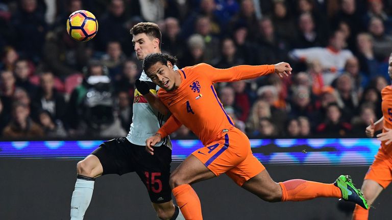 Belgium's defender Thomas Meunier (L) and Netherlands' defender Virgil van Dijk vie for the ball during a friendly football match between The Netherlands a