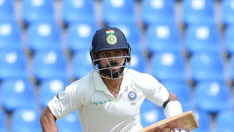 Indian cricket captain Virat Kohli runs between the wickets during the first day of the third and final Test match between Sri Lanka and India at the Palle