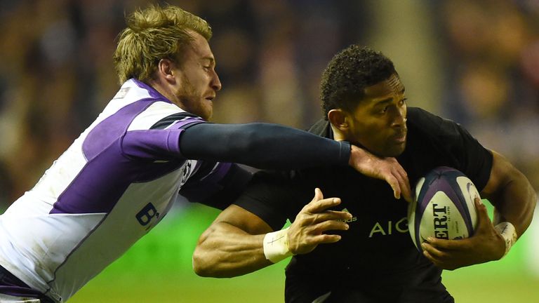 New Zealand's wing Waisake Naholo (R) is tackled during the international rugby union test match between Scotland and New Zealand at Murrayfield stadium in