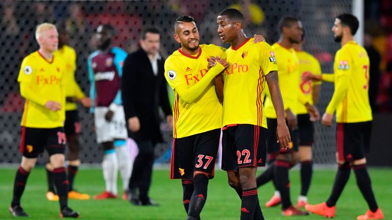 Watford's Argentinian midfielder Roberto Pereyra (L) shakes hands with Watford's Dutch midfielder Marvin Zeegelaar (R) at the end of the English Premier Le