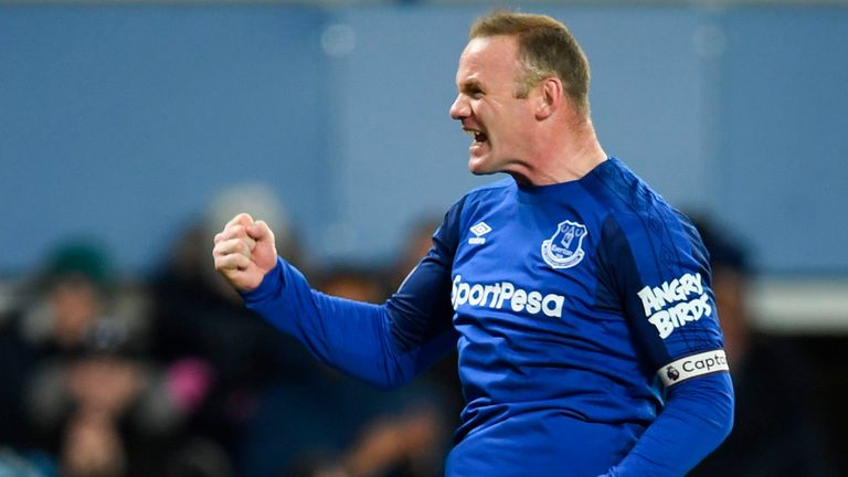 Everton's English striker Wayne Rooney celebrates scoring from the rebound after his penalty was saved to score the opening goal during the English Premier