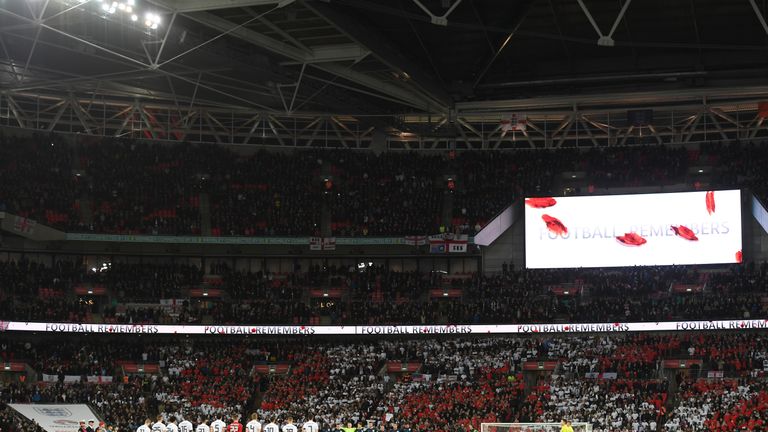 LONDON, ENGLAND - NOVEMBER 10:  Players line up for a minute's silence ahead of Remembrance Sunday prior to the International friendly match between Englan