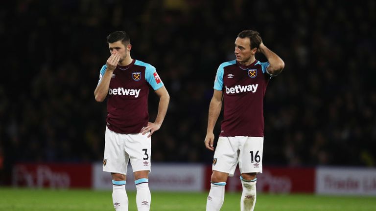 Aaron Cresswell and Mark Noble look on as West Ham go 2-0 down at Watford