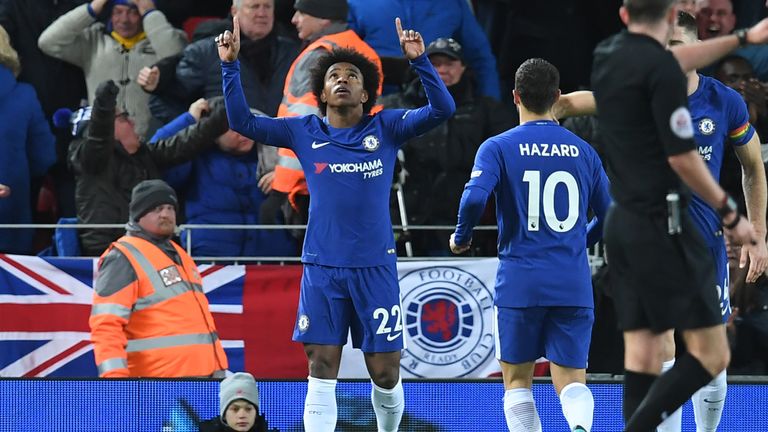Willian (C) celebrates after scoring Chelsea's first goal during the English Premier League football match between Liverpool and Chelsea