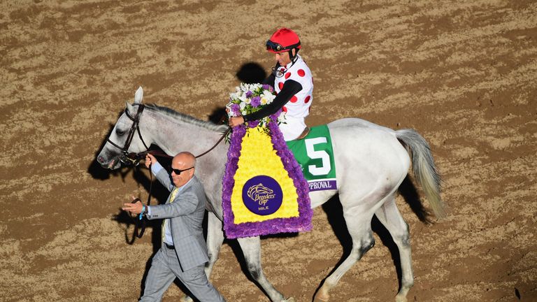 Jockey John Velazquez celebrates after riding World Approval to a win in the Breeders' Cup Mile
