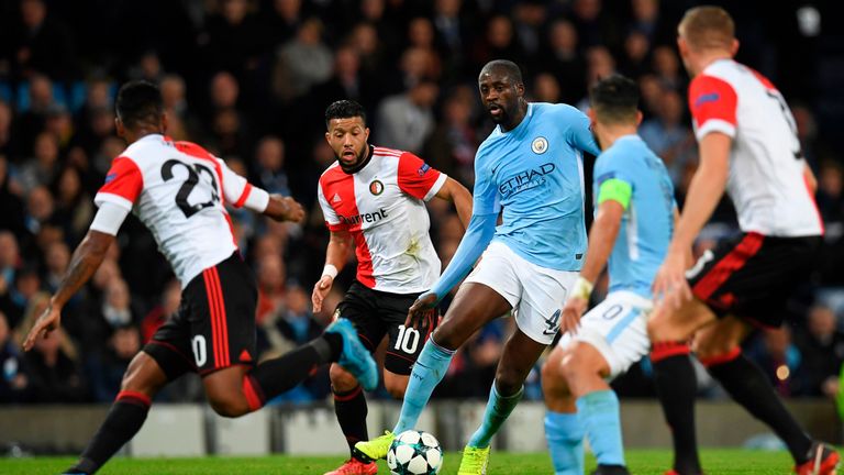 Yaya Toure (C) runs at the Feyenoord defence