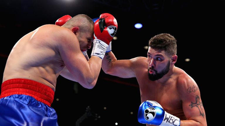 LIVERPOOL, ENGLAND - OCTOBER 15:  Tony Bellew of England lands a right hand punch on BJ Flores of USA in the WBC Cruiserweight Championship match during Bo