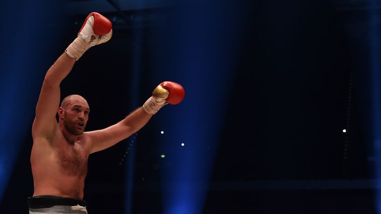 British Tyson Fury celebrates after the WBA, IBF, WBO and IBO title bout against Ukrainian world heavyweight boxing champion Wladimir Klitschko in Duesseld