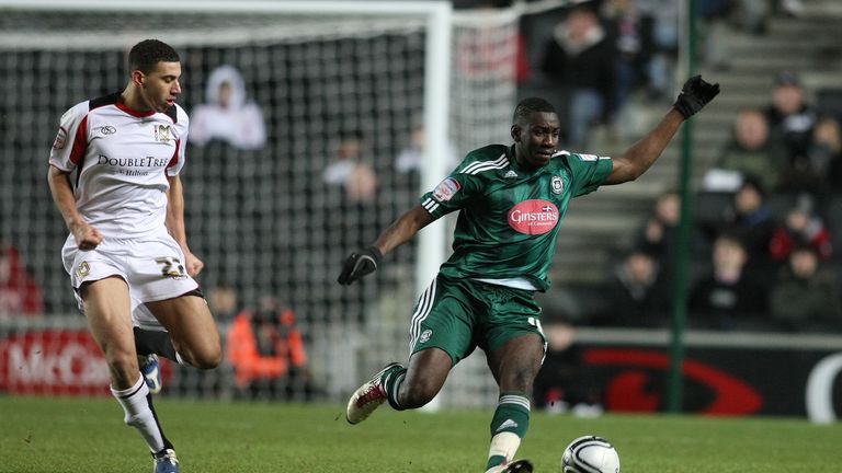 Yannick Bolasie of Plymouth Argyle controls the ball watched by Daniel Powell of MK Dons during the League One match in 2011