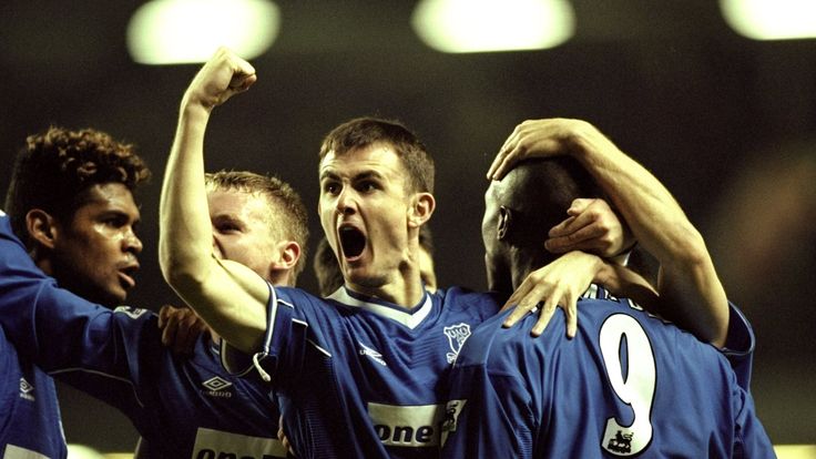 Everton players celebrate Kevin Campbell's early goal at Anfield