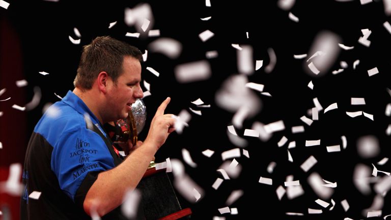 LONDON, ENGLAND - JANUARY 03:  Adrian Lewis of England holds the trophy after winning against Gary Anderson of Scotland in the Final of the 2011 Ladbrokes.