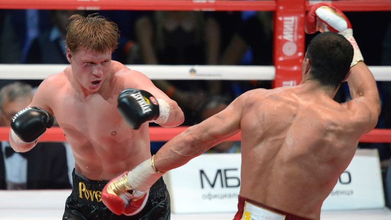 Ukrainian heavyweight boxing world champion Vladimir Klitschko (R) fights with Russian heavyweight boxer Alexander Povetkin during their fight in Moscow on