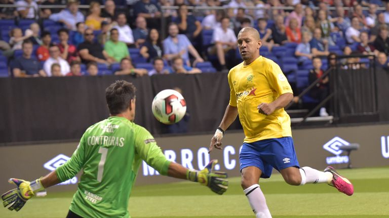 Brazil's Djalminha scores during the Star Sixes 3rd place playoff football match between Spain and Brazil at the O2 Arena in London on July 16, 2017
