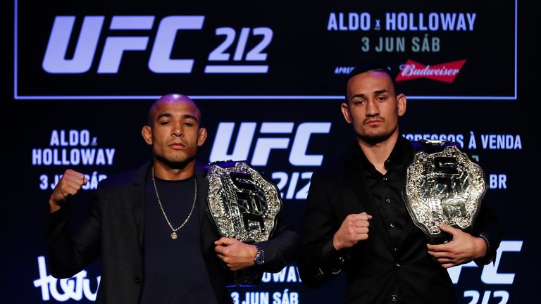 RIO DE JANEIRO, BRAZIL - APRIL 11: UFC Featherweight Champion Jose Aldo of Brazil (L) and challenger Max Holloway of the United States pose for photographe