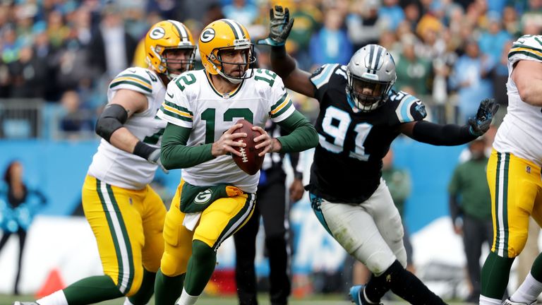 CHARLOTTE, NC - DECEMBER 17:  Aaron Rodgers #12 of the Green Bay Packers runs the ball against the Carolina Panthers in the second quarter during their gam