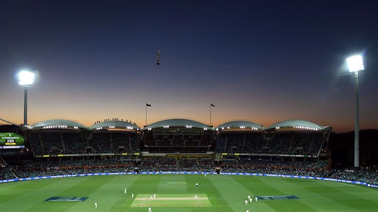 Australia and England play under lights on the third day of the second Ashes cricket Test match in Adelaide in December 4, 2017. / AFP PHOTO / William WEST