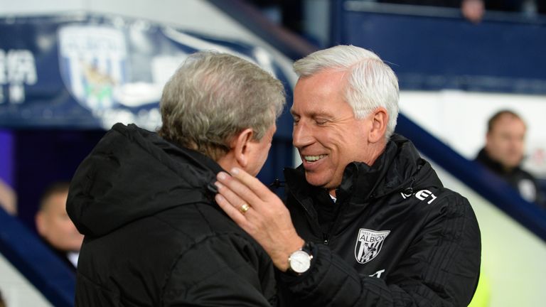 WEST BROMWICH, ENGLAND - DECEMBER 02: Alan Pardew, Manager of West Bromwich Albion and Roy Hodgson, Manager of Crystal Palace embrace prior to the Premier 