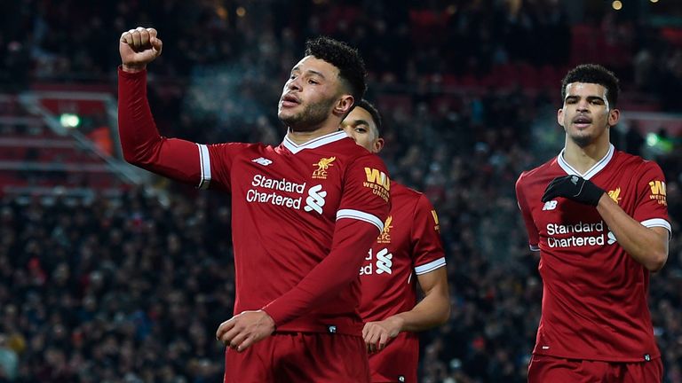 Liverpool's English midfielder Alex Oxlade-Chamberlain (L) celebrates scoring their fifth goal with Liverpool's English midfielder Trent Alexander-Arnold (