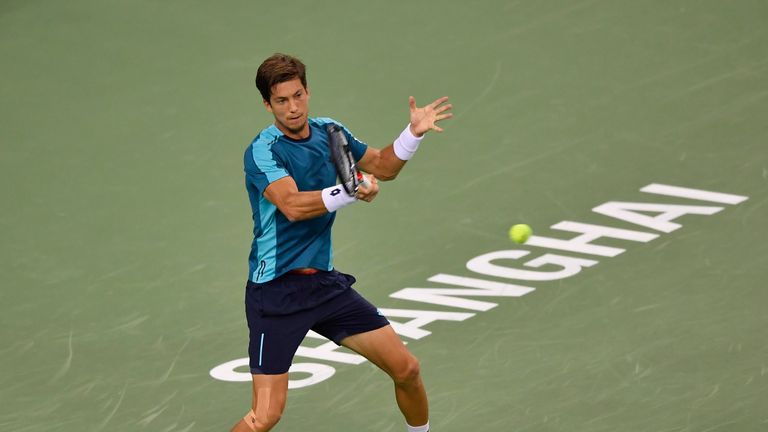 SHANGHAI, CHINA - OCTOBER 11: Aljaz Bedene of Great Britain returns a shot to Alexander Zverev of Germany in their Men's Single match during Round 2 of 201