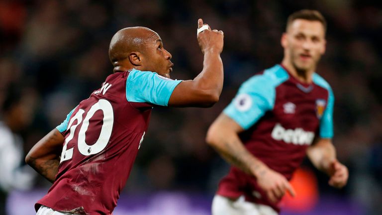 Andre Ayew celebrates after reducing the deficit at at The London Stadium