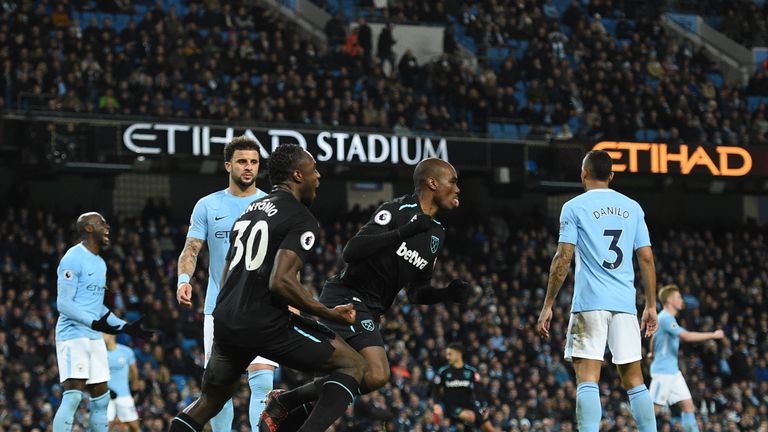 West Ham United's Italian defender Angelo Ogbonna (C) celebrates scoring the opening goal during the English Premier League football match between Manchest