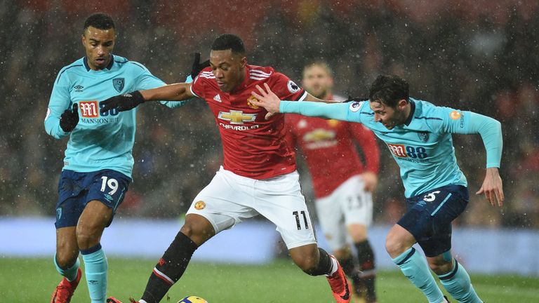 Anthony Martial holds off Junior Stanislas and Adam Smith