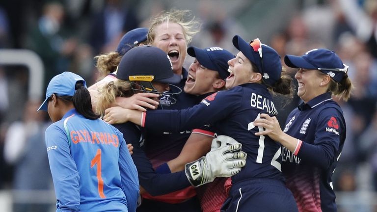 England's Anya Shrubsole (C) celebrates with teammates as she takes the wicket of India's Rajeshwari Gayakwad to win the ICC Women's World Cup cricket fina