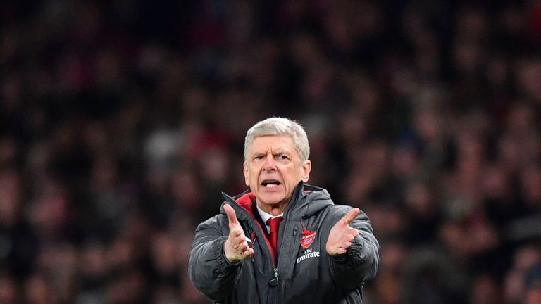 Arsenal's French manager Arsene Wenger gestures from the touchline during the English League Cup quarter-final football match between Arsenal and West Ham 