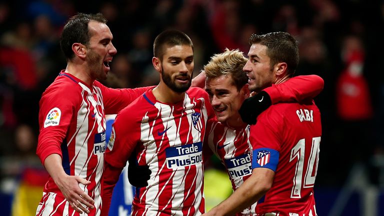 MADRID, SPAIN - DECEMBER 02: Antoine Griezmann (2ndR) of Atletico de Madrid celebrates scoring their second goal with teammates Gabi Fernandez (R); Yannick