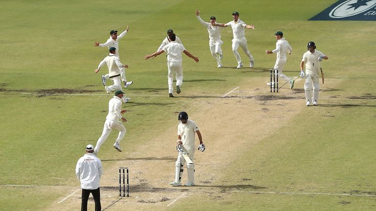 PERTH, AUSTRALIA - DECEMBER 18:  Australia celebrate after Pat Cummins of Australia claimed the final wicket of Chris Woakes of England to claim victory du