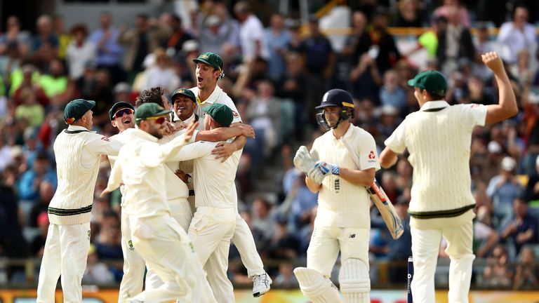 Australia celebrate after Pat Cummins of Australia claimed the final wicket of Chris Woakes of England to claim victory