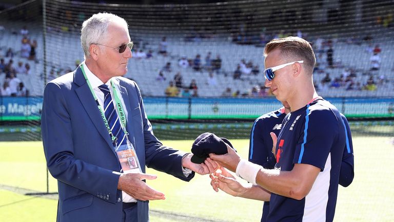 MELBOURNE, AUSTRALIA - DECEMBER 26:  Tom Curran of England receives his Test Cap from former England Cricketer Bob Willis during day one of the Fourth Test