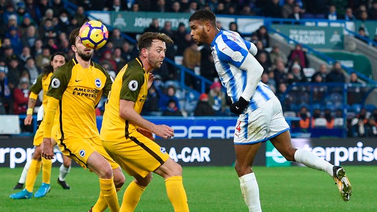 Huddersfield's Steve Mounie, right, scores their second goal in the 2-0 defeat of Brighton